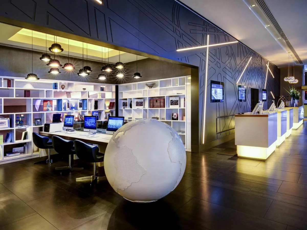 a room with a table with a large globe on the floor at Pullman London St Pancras in London