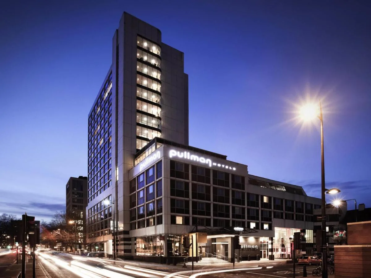 a tall building with a street light in front of it at Pullman London St Pancras in London